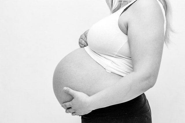 pregnant lady about to give birth in black and white